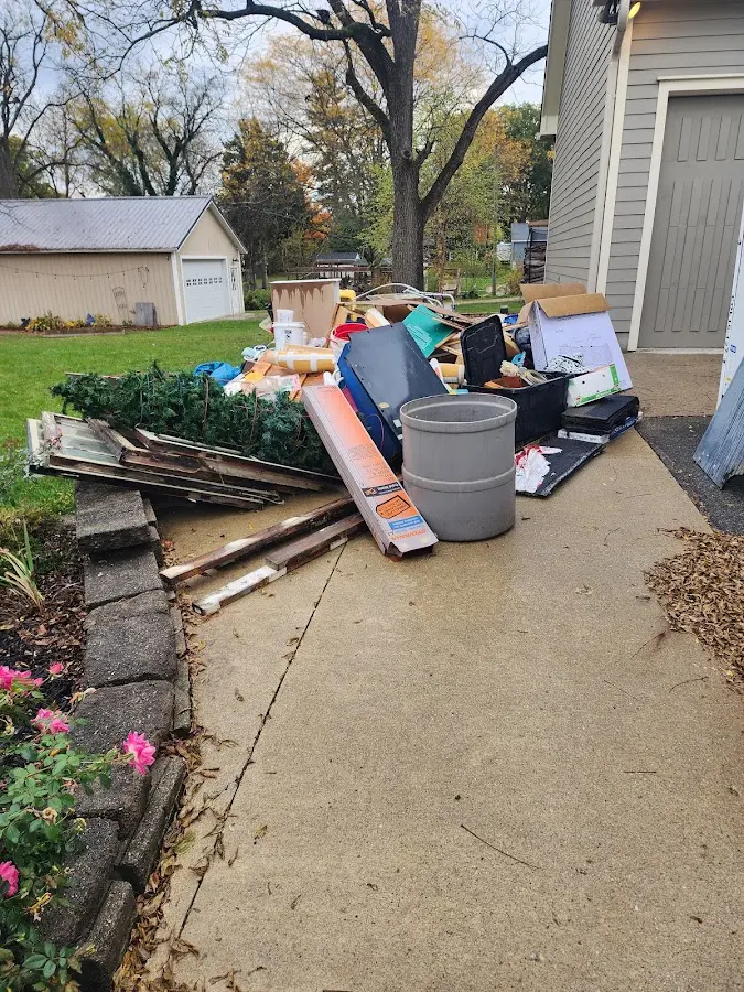 Dumpster being loaded with debris for 3 Yard Dumpster Rental in Marysville